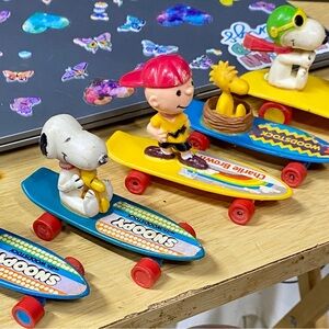 Peanuts Skateboard Adventure Figures - Blue, Yellow, Red